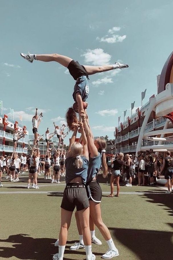 cheerleaders doing group stunt