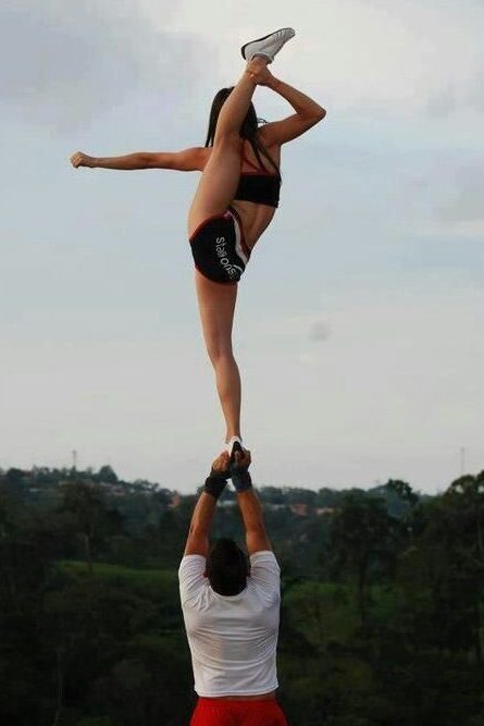 cheerleader doing partner stunt